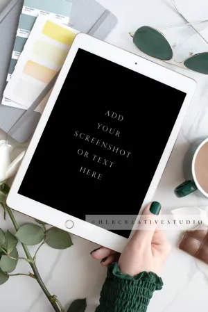 Hand Holding Tablet with Green Nails. Digital Stock Image