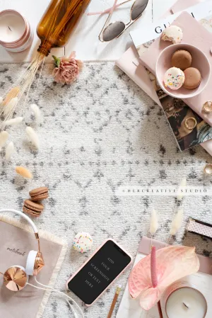 Smartphone, Macarons & Heaphones Workspace. Digital Image.